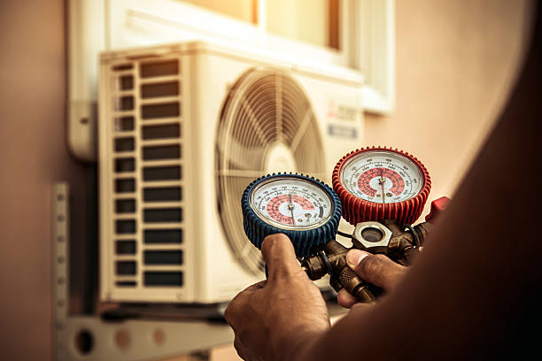 Professional Air Conditioning Service technician working in Weston, WI